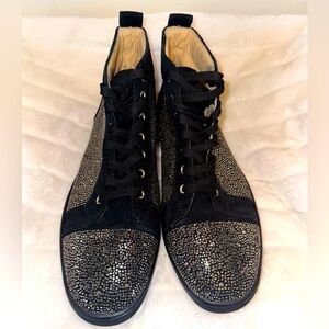 Men’s Christian Louboutin black sneakers with silver rhinestone embellishments.